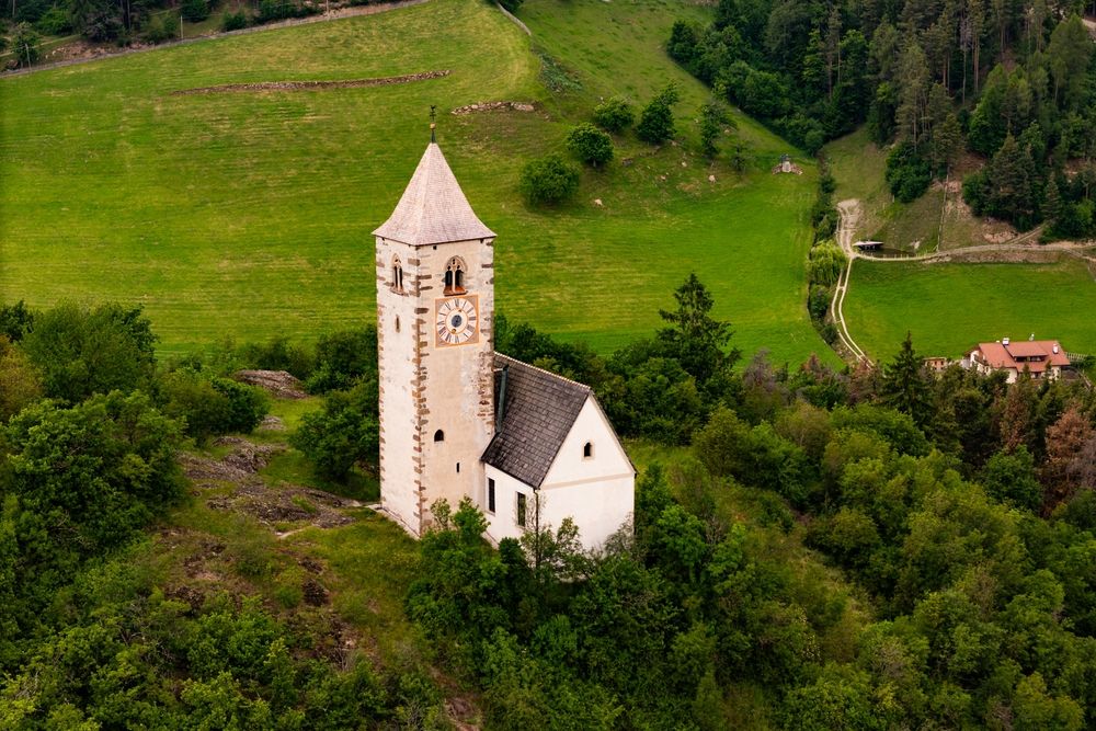 A church bell tower among trees