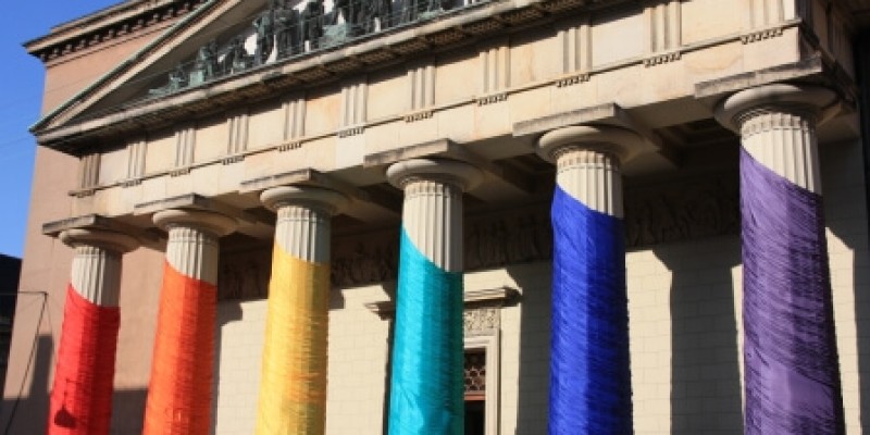Courthouse draped in LGBTQ rainbow.