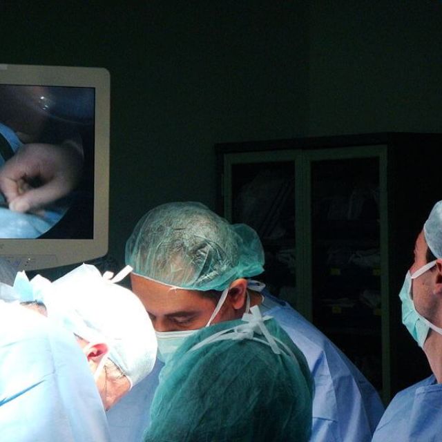 Doctors performing an abortion on a woman.