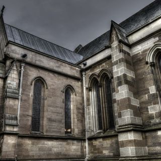 The outside of a church in a gray sky