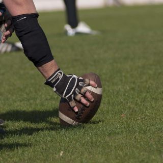 A federal judge has sided with Washington State over its firing of a football coach who refused vaccination based on religious grounds.