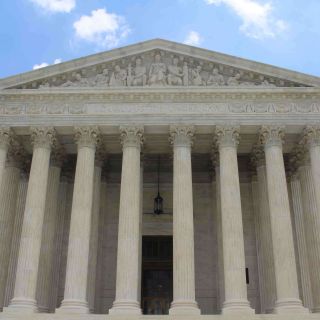 A picture of the building housing the Supreme Court of the U.S.