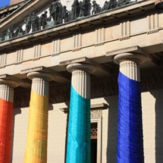 Courthouse draped in LGBTQ rainbow.