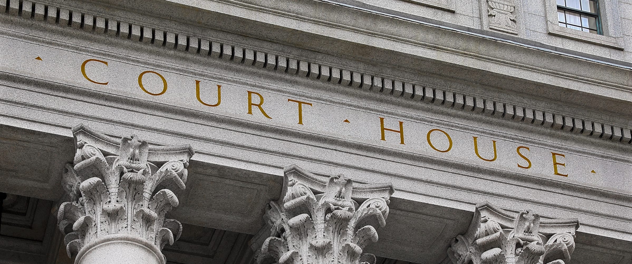 The front of a court house with visible text
